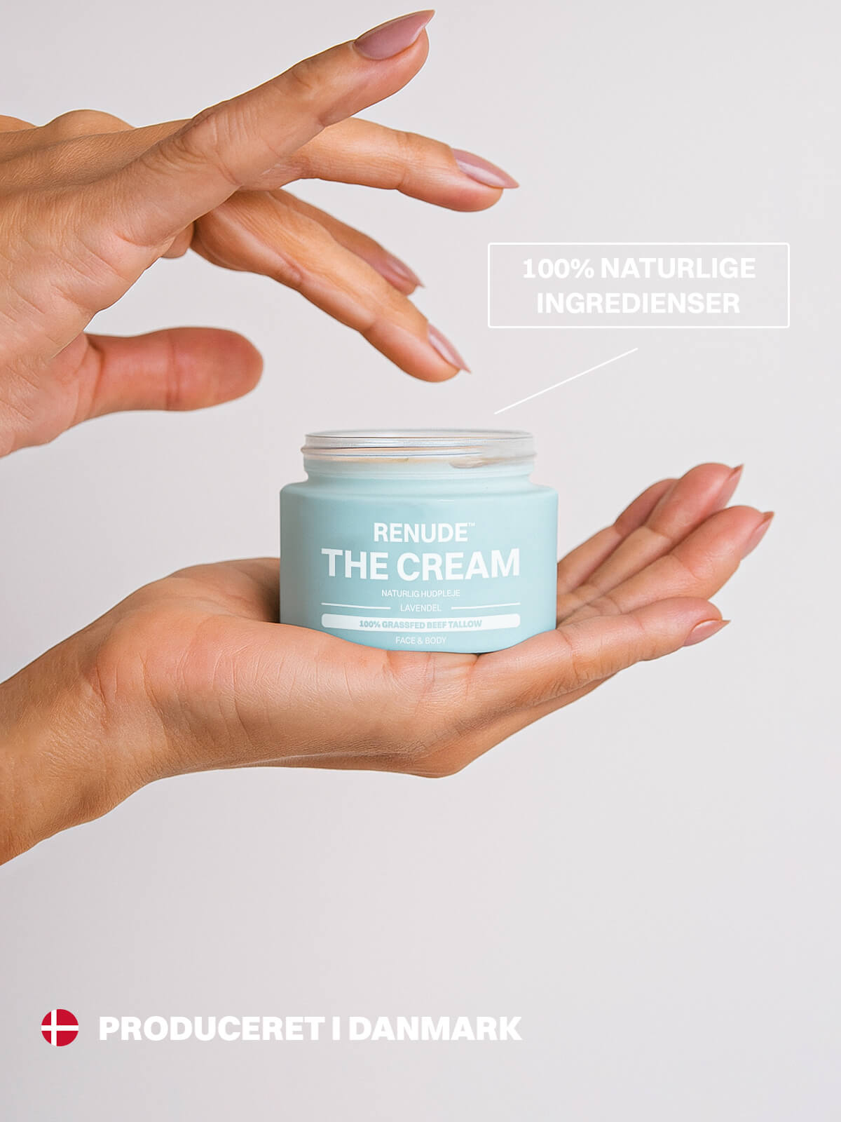 Renude The Cream krukke i hånd med dansk produktmærkning